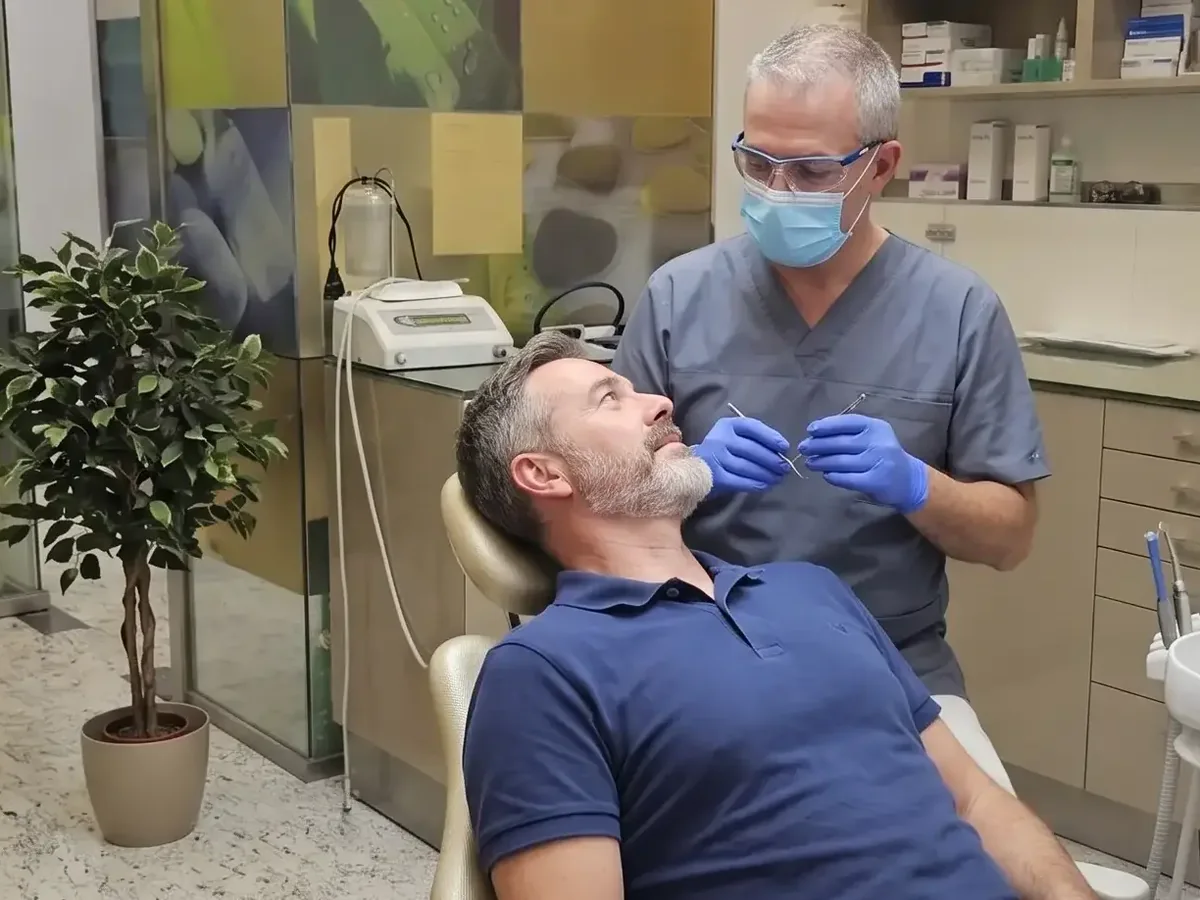Dentist discussing crown treatment with a patient in the Budapest clinic