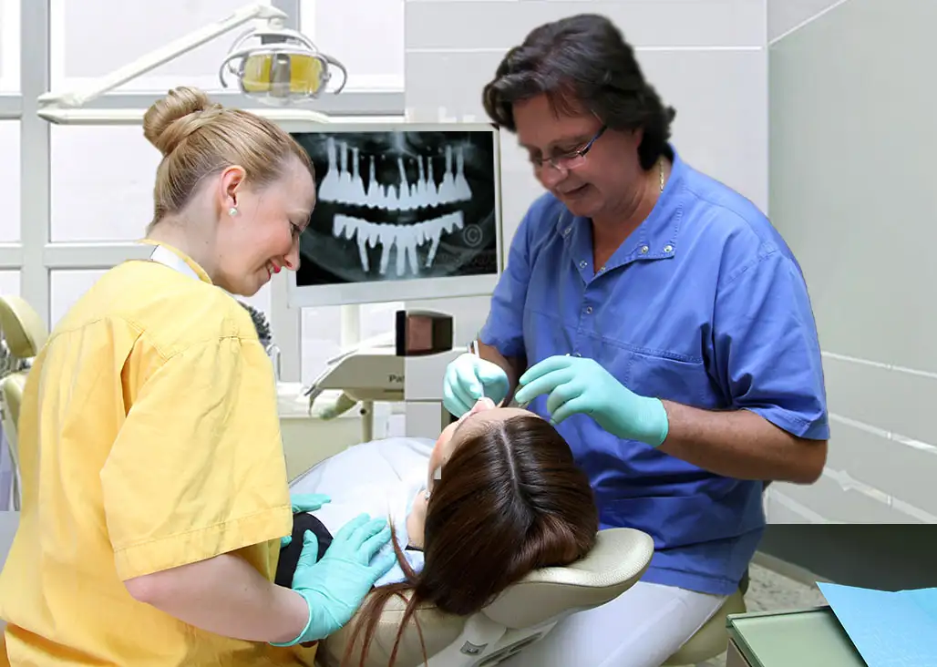 Hungarian Dentist, maxillo-facial surgeon and master implantologist, Dr Kaman, with a patient at our London clinic.